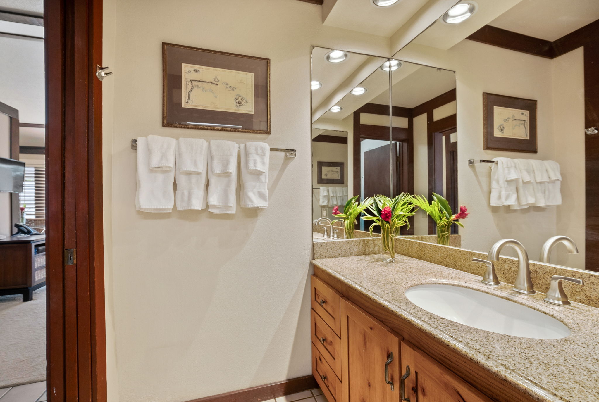 2253 Poipu Road, Unit 109 Koloa, HI 96756 - Photo 12 of 30 a bathroom with a granite countertop double vanity and a mirror
