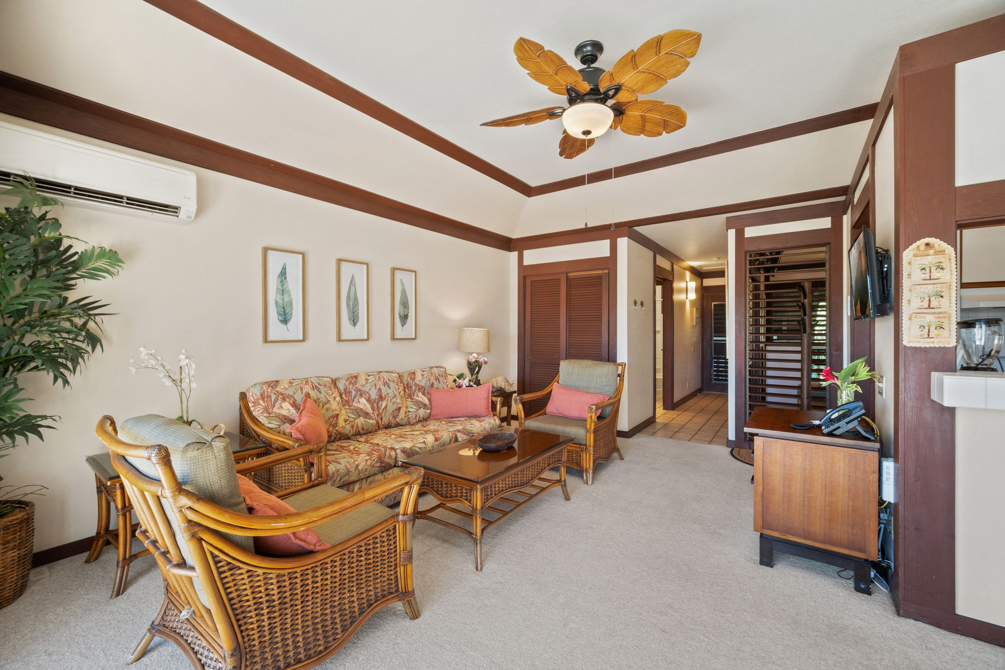 2253 Poipu Road, Unit 109 Koloa, HI 96756 - Photo 18 of 30 a living room with furniture a rug and a ceiling fan