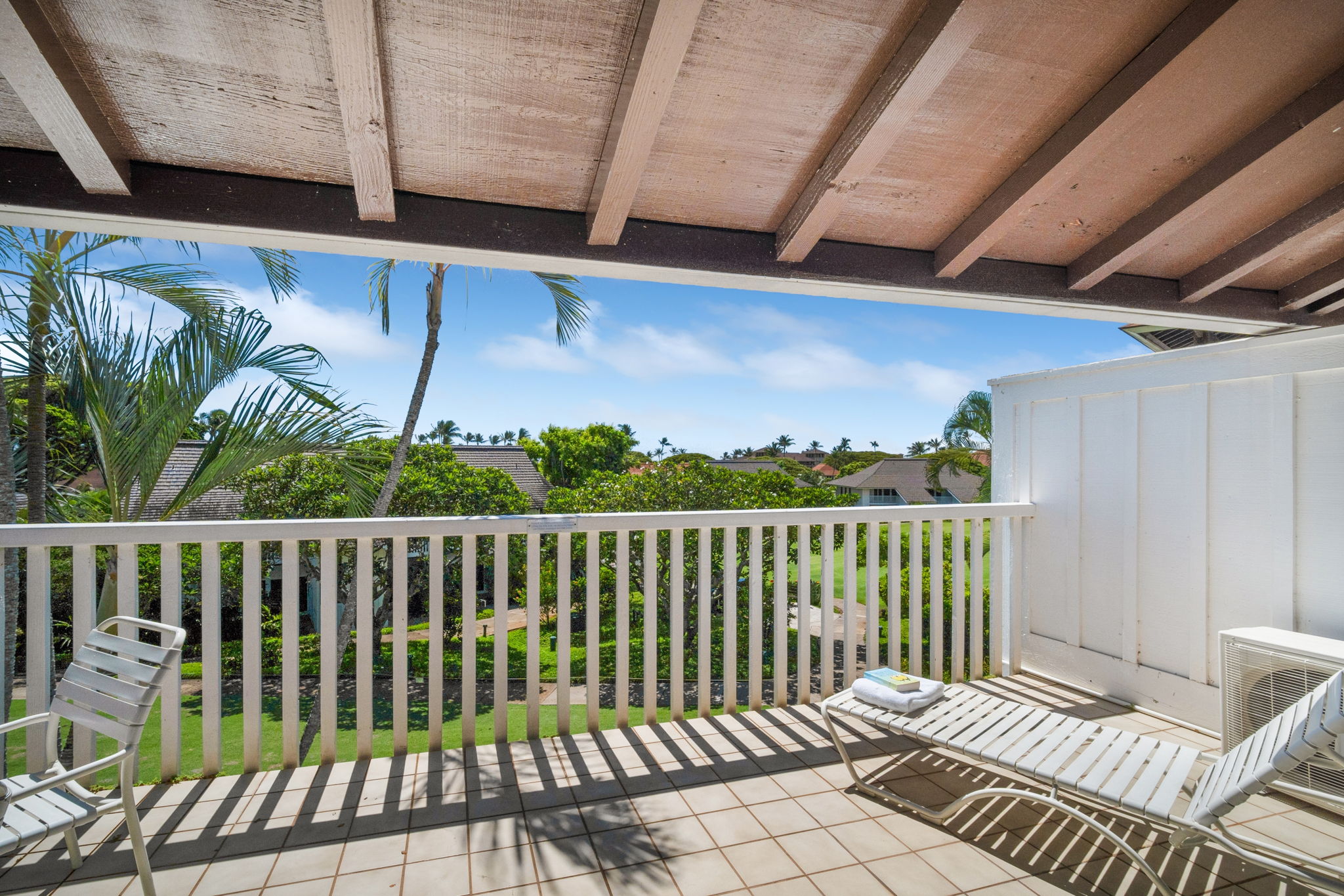 2253 Poipu Road, Unit 109 Koloa, HI 96756 - Photo 24 of 30 a balcony with wooden floor