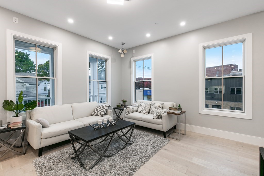 88 Dover Street, Unit 2 Somerville, MA 02144 - Photo 11 of 36 a living room with furniture and a large window