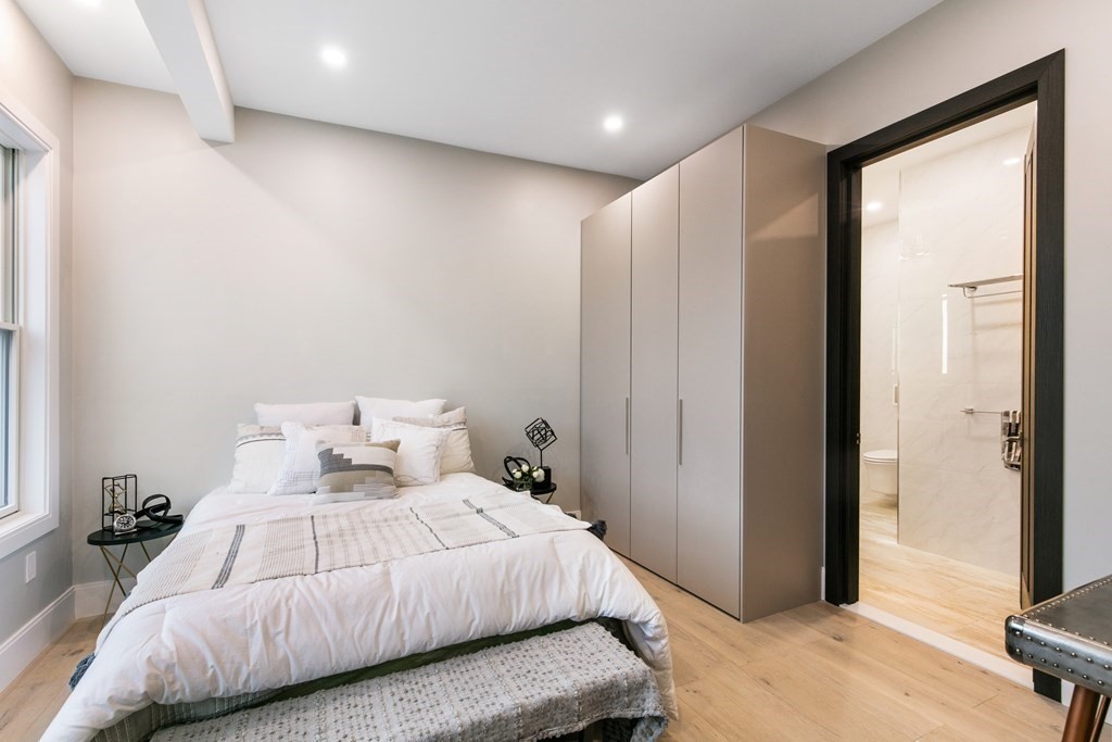 88 Dover Street, Unit 2 Somerville, MA 02144 - Photo 13 of 36 a bedroom with a large bed and a large window