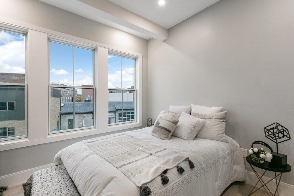 88 Dover Street, Unit 2 Somerville, MA 02144 - Photo 14 of 36 a bedroom with a bed and a large window