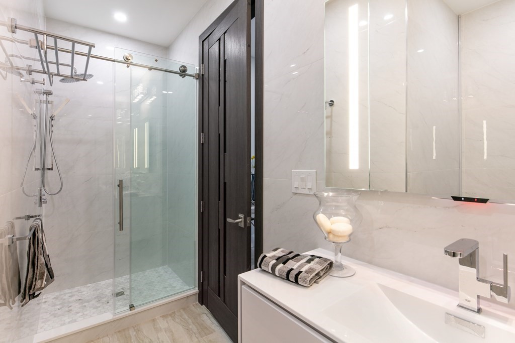 88 Dover Street, Unit 2 Somerville, MA 02144 - Photo 16 of 36 a bathroom with a sink a toilet and shower