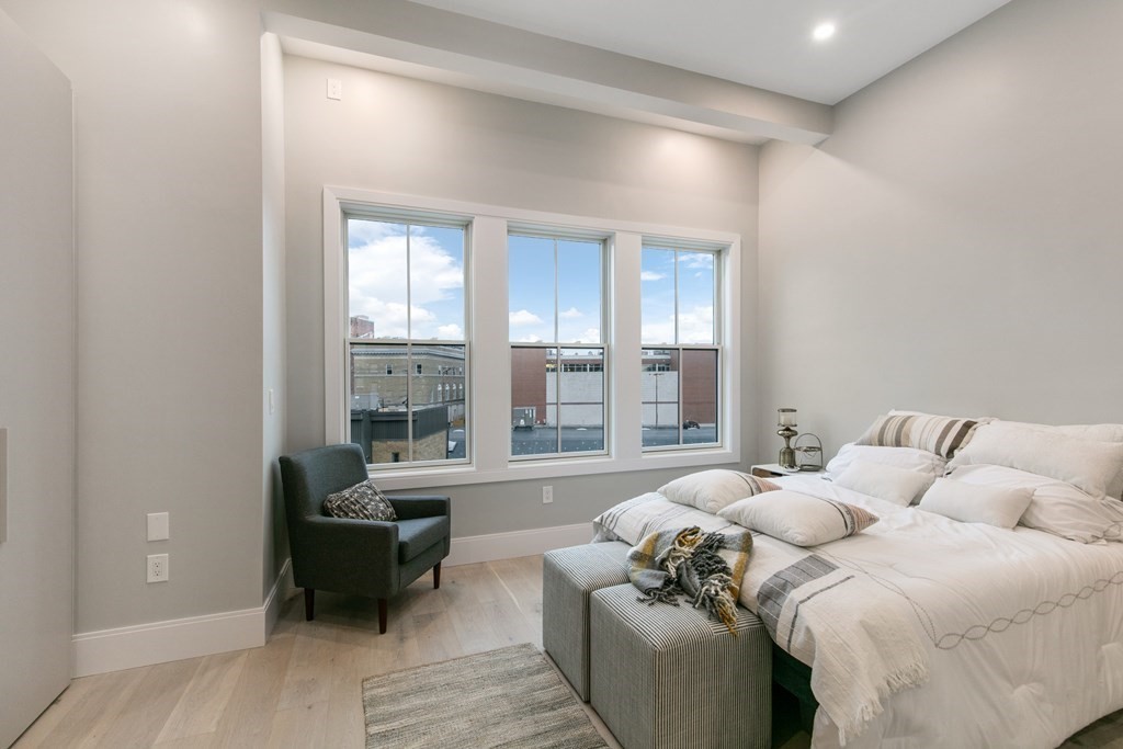 88 Dover Street, Unit 2 Somerville, MA 02144 - Photo 19 of 36 a living room with furniture and a large window