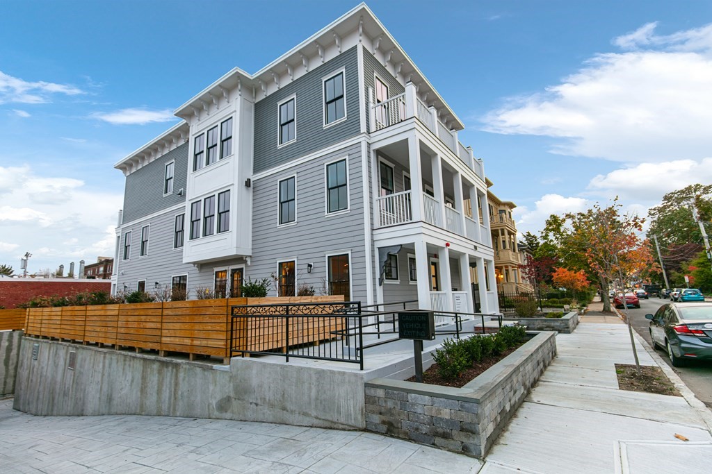 88 Dover Street, Unit 2 Somerville, MA 02144 - Photo 2 of 36 a view of a large building and a street