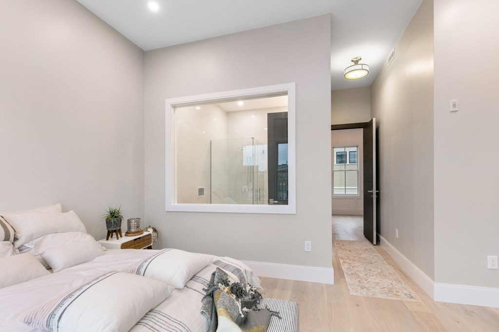 88 Dover Street, Unit 2 Somerville, MA 02144 - Photo 22 of 36 a bedroom with furniture and a window