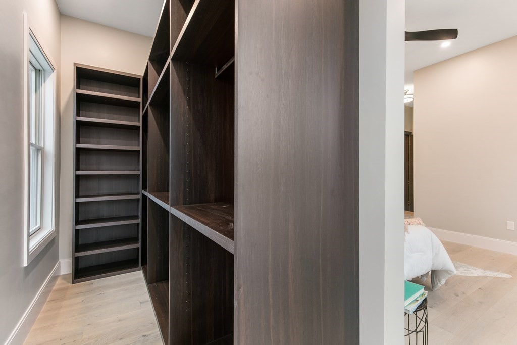 88 Dover Street, Unit 2 Somerville, MA 02144 - Photo 28 of 36 a view of walk in closet with empty racks