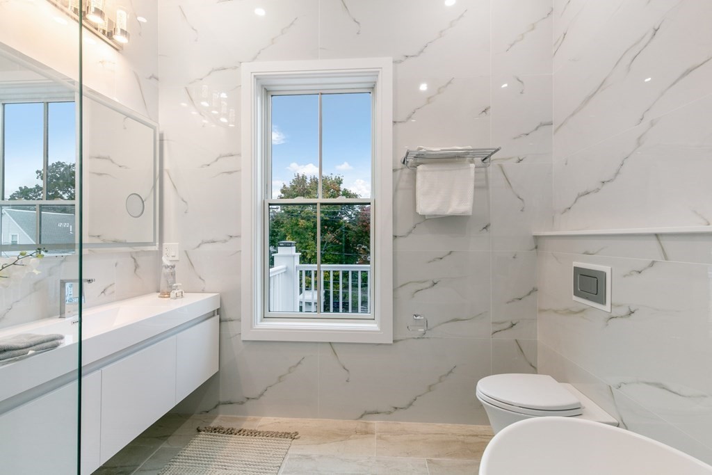 88 Dover Street, Unit 2 Somerville, MA 02144 - Photo 30 of 36 a bathroom with a sink and toilet