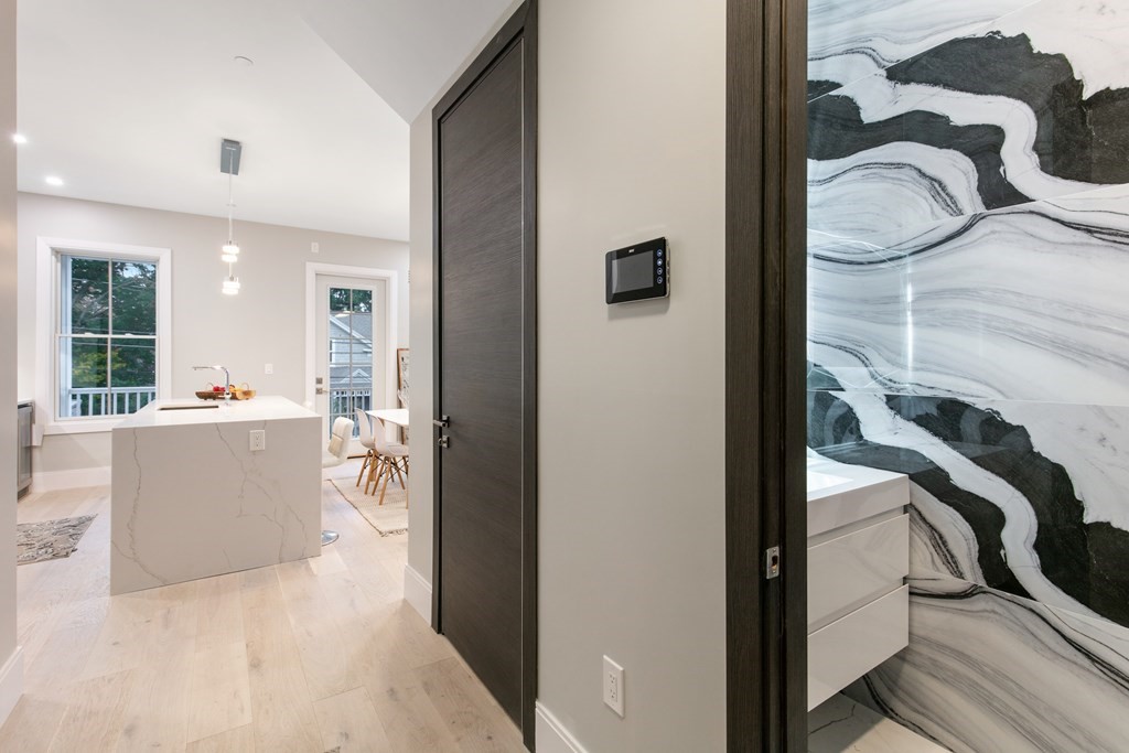 88 Dover Street, Unit 2 Somerville, MA 02144 - Photo 3 of 36 a view of a hallway with dining area