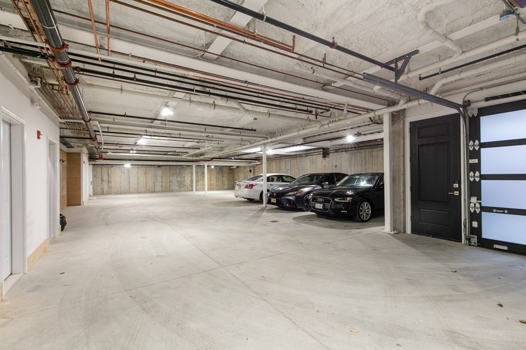 88 Dover Street, Unit 2 Somerville, MA 02144 - Photo 33 of 36 a view of parking garage with parked cars
