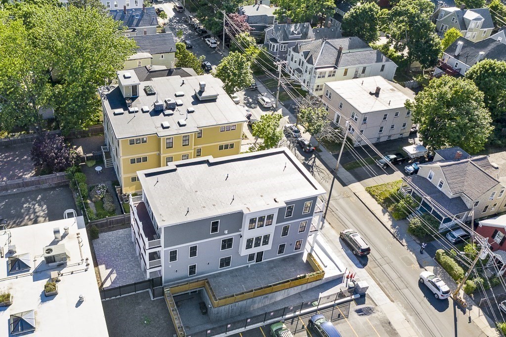 88 Dover Street, Unit 2 Somerville, MA 02144 - Photo 35 of 36 an aerial view of a house with a swimming pool and outdoor seating