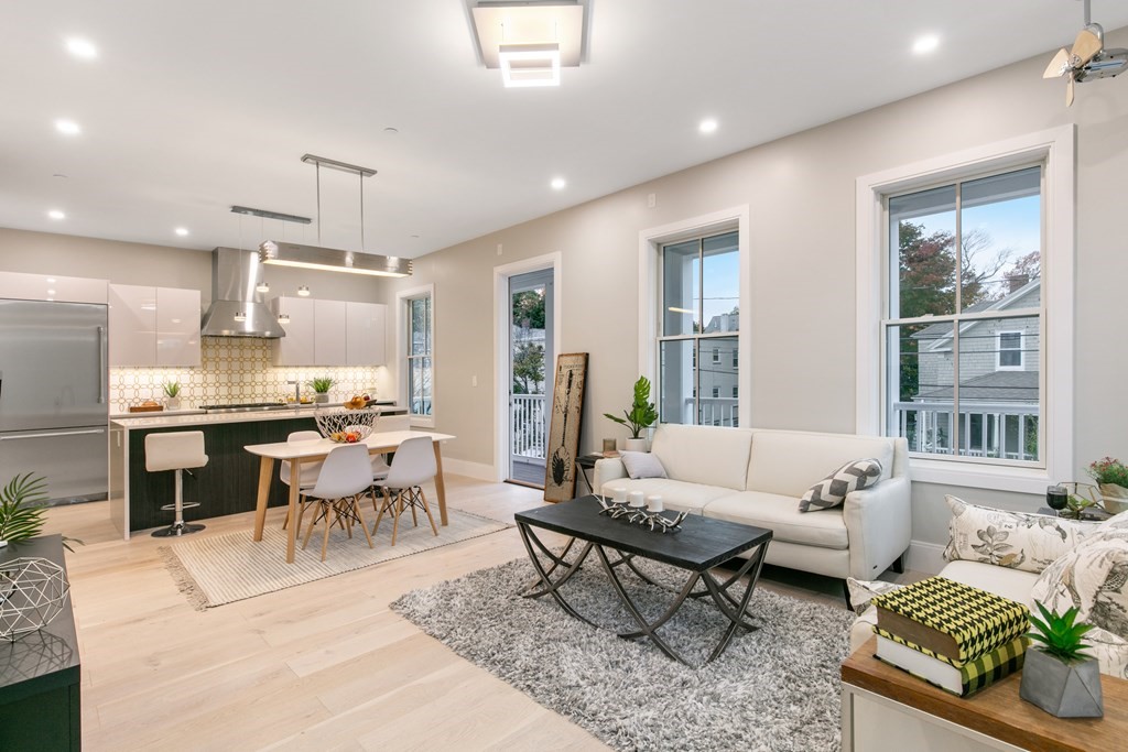 88 Dover Street, Unit 2 Somerville, MA 02144 - Photo 10 of 36 a living room with furniture kitchen view and a large window