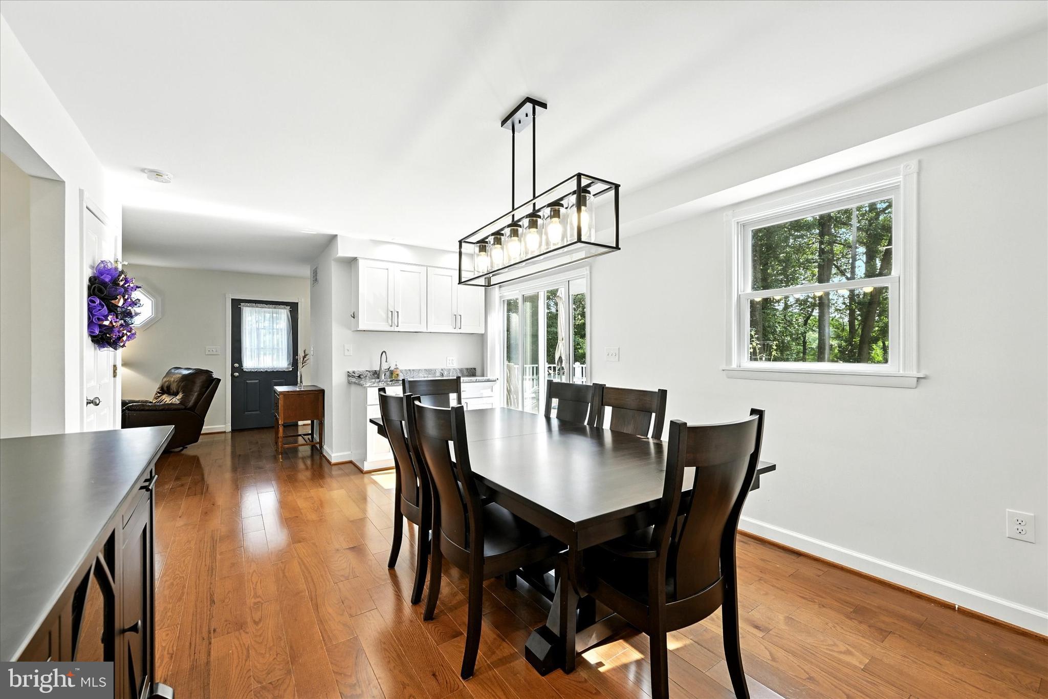 3111 Northwind Road Baltimore, MD 21234 - Photo 15 of 81 a view of a dining room with furniture window and wooden floor
