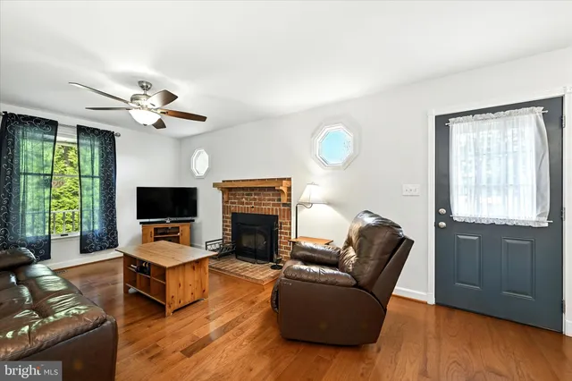 a bathroom with a double vanity sink a mirror and a shower