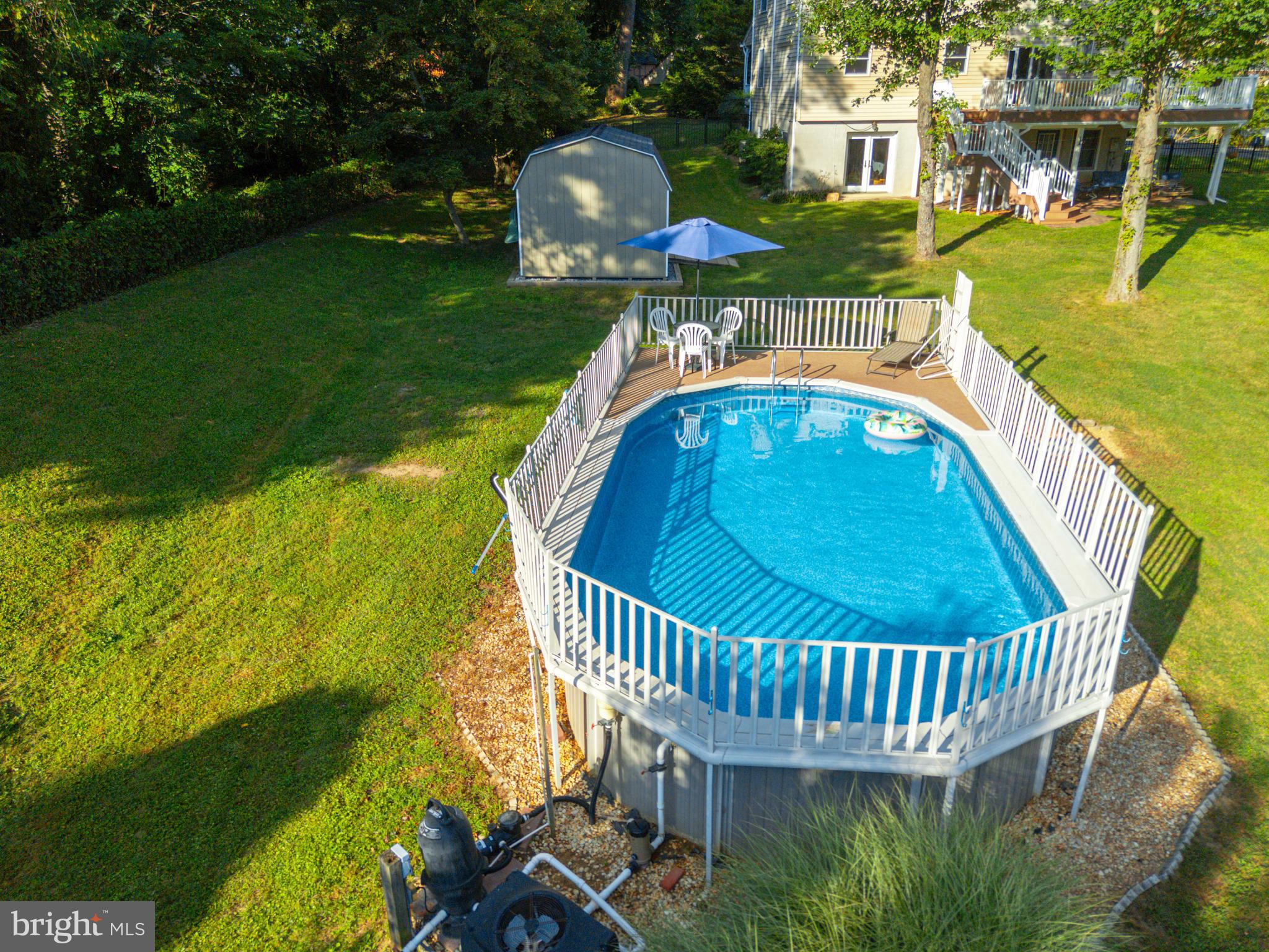 3111 Northwind Road Baltimore, MD 21234 - Photo 63 of 81 a view of a swimming pool with a patio and garden