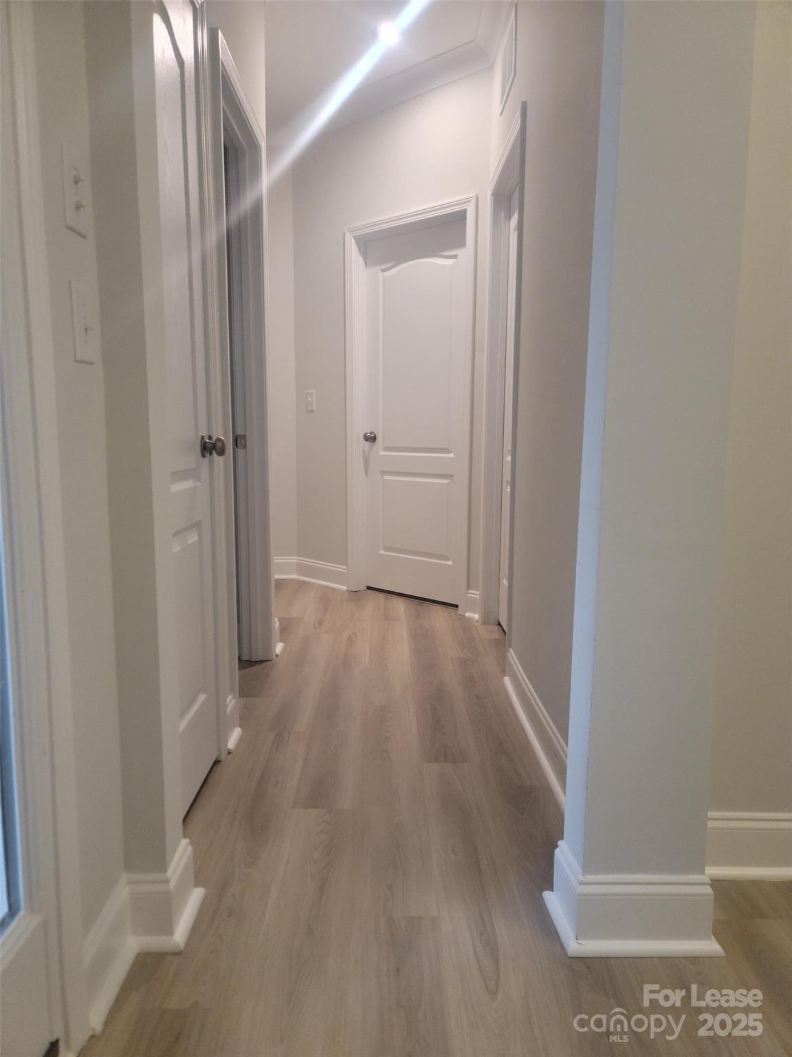 1115 Kalli Drive Matthews, NC 28104 - Photo 15 of 22 a view of a hallway with wooden floor