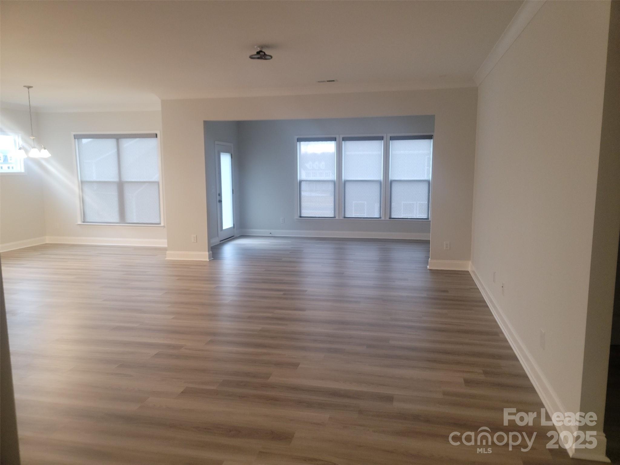 1115 Kalli Drive Matthews, NC 28104 - Photo 21 of 22 a view of empty room with wooden floor and fan
