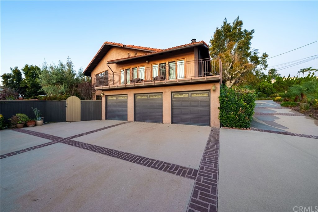 2640 Colt Road Rancho Palos Verdes, CA 90275 - Photo 1 of 1 a front view of a house with garage and yard