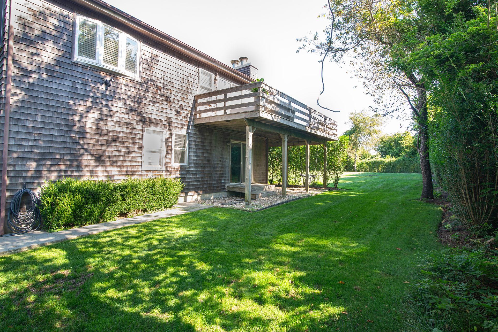28 Ditch Plains Road Montauk, NY 11954 - Photo 20 of 30 a view of a house with backyard porch and sitting area