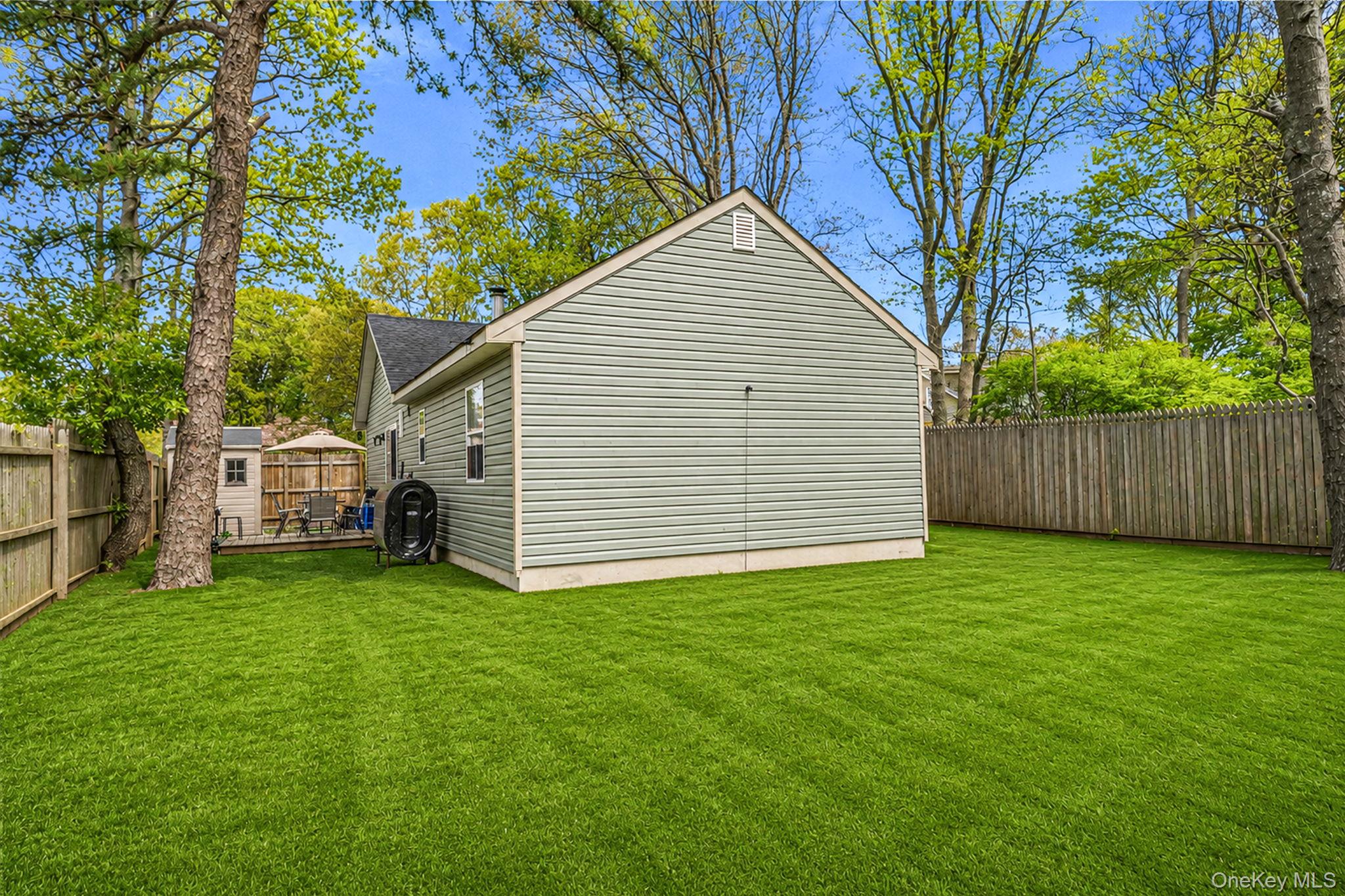 332 Commack Road Shirley, NY 11967 - Photo 23 of 25 a view of a house with a yard