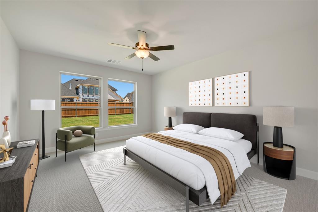 4308 Palomino Road Aubrey, TX 76227 - Photo 25 of 40 a bedroom with a bed and wooden floor