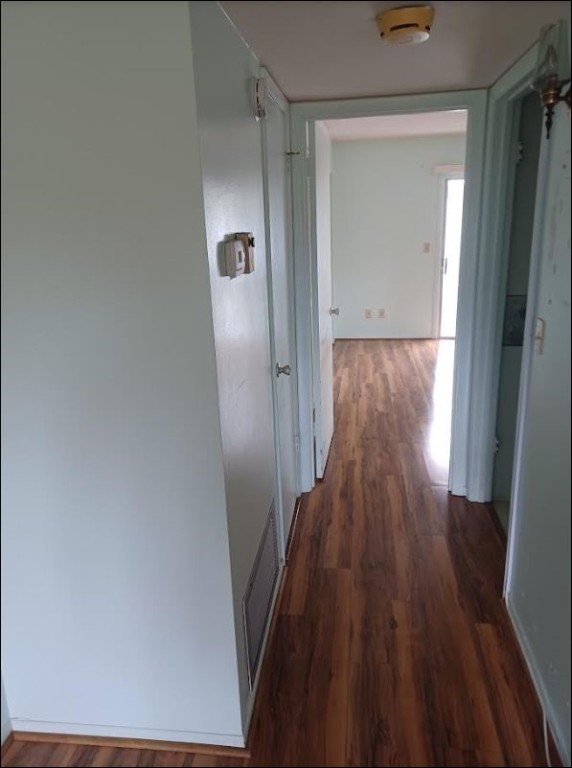 Undisclosed Address Vero Beach, FL 32962 - Photo 14 of 30 a view of a hallway with wooden floor and staircase