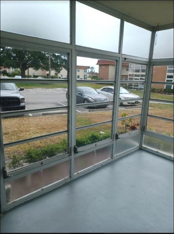 Undisclosed Address Vero Beach, FL 32962 - Photo 23 of 30 a view of a room with wooden floor and iron stairs