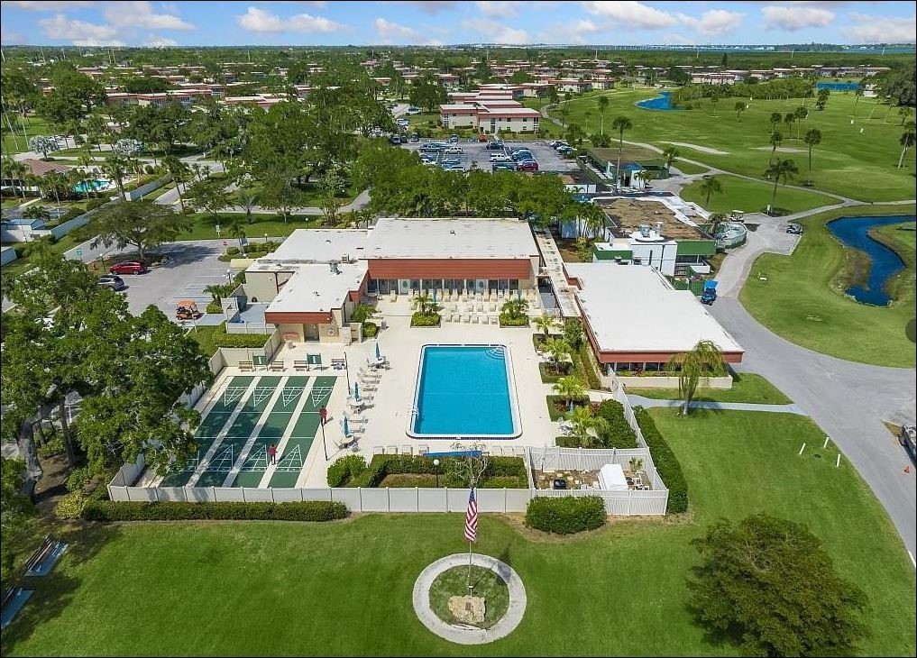 Undisclosed Address Vero Beach, FL 32962 - Photo 27 of 30 an aerial view of a residential apartment building with a yard