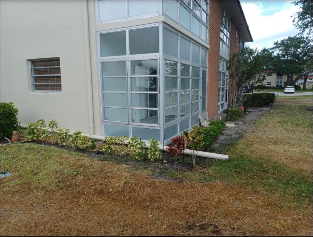 Undisclosed Address Vero Beach, FL 32962 - Photo 6 of 30 a view of a chair and table in backyard