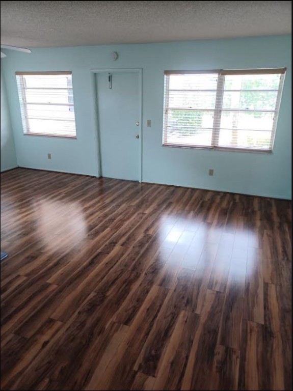 Undisclosed Address Vero Beach, FL 32962 - Photo 10 of 30 an empty room with wooden floor and windows