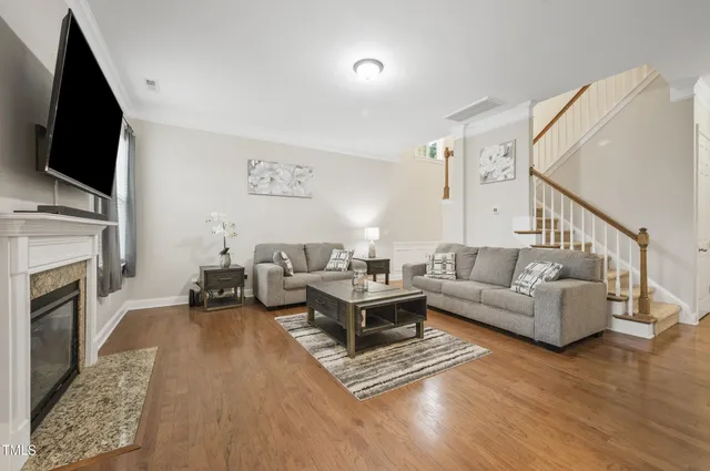 a living room with furniture and a table