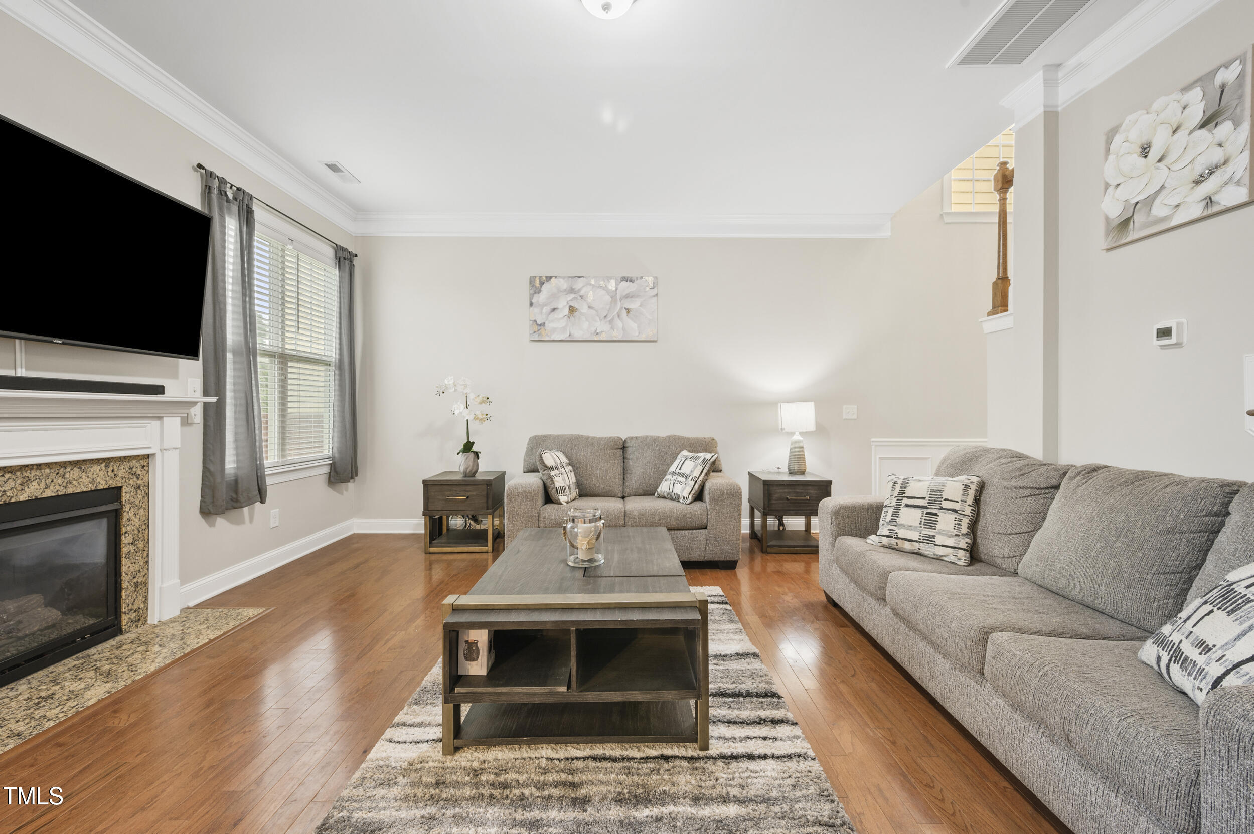 1204 Chapanoke Road Raleigh, NC 27603 - Photo 12 of 45 a living room with furniture fireplace and flat screen tv