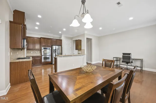 a view of a dining room with furniture and window