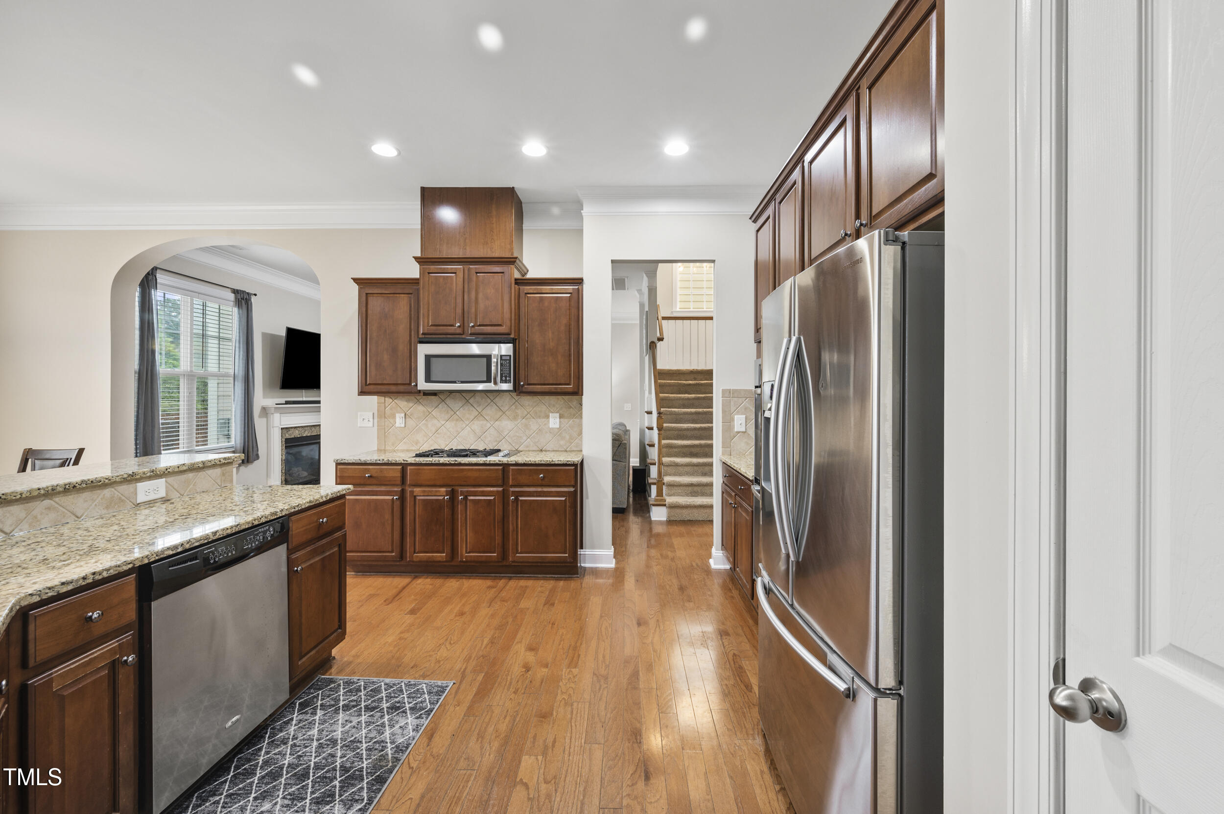 1204 Chapanoke Road Raleigh, NC 27603 - Photo 17 of 45 a kitchen with stainless steel appliances granite countertop a refrigerator a stove and a sink