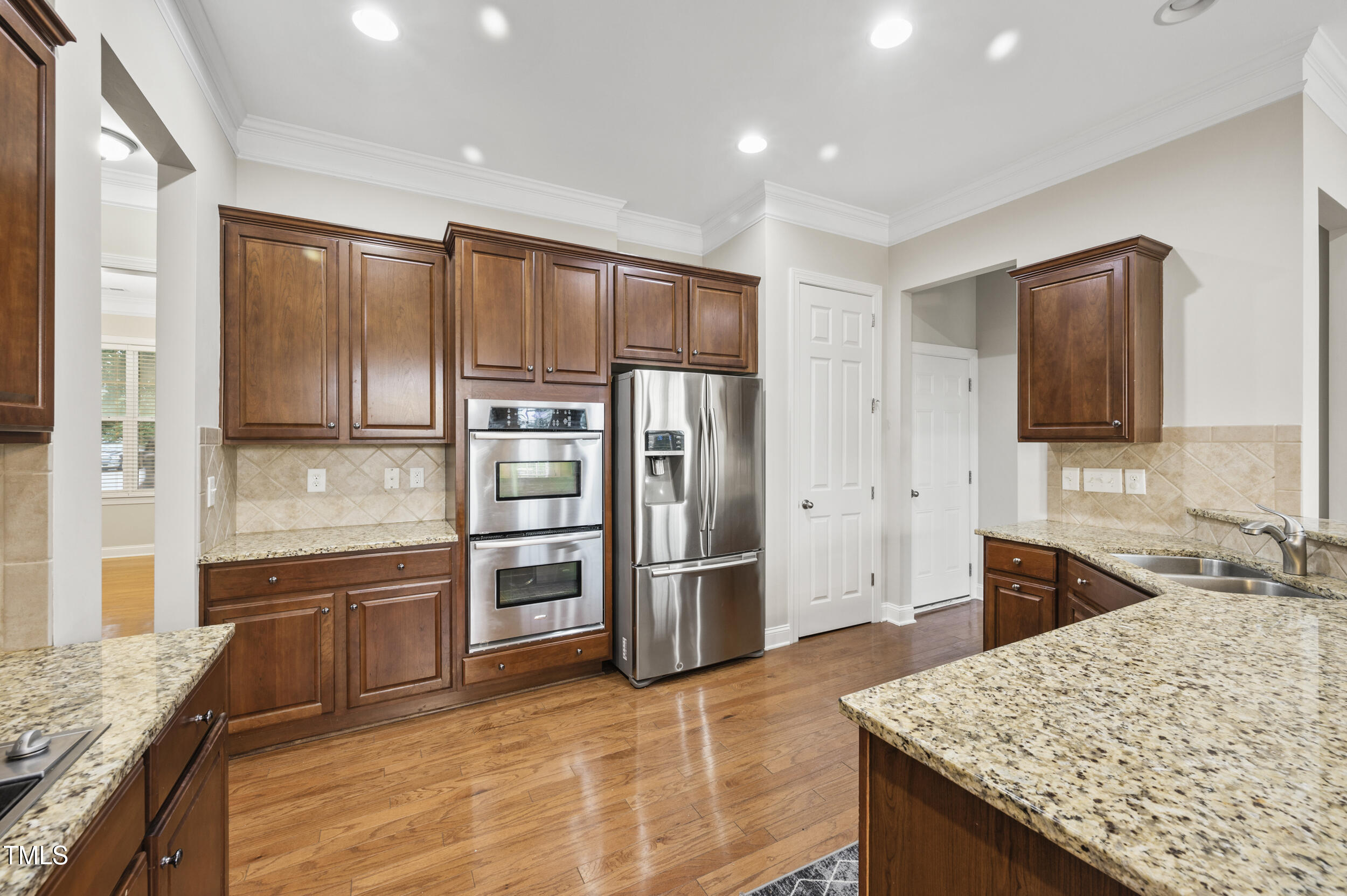 1204 Chapanoke Road Raleigh, NC 27603 - Photo 19 of 45 a kitchen with stainless steel appliances granite countertop a refrigerator oven a sink and dishwasher