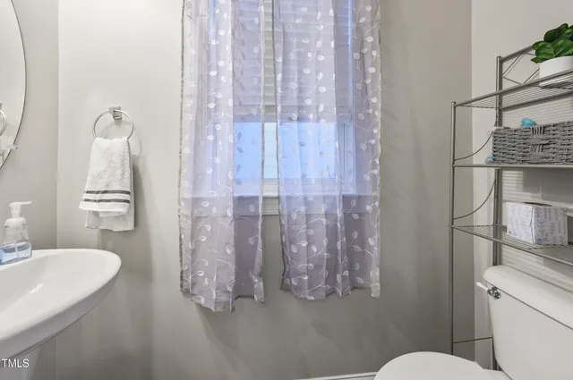 a kitchen with granite countertop a stove and a wooden floors