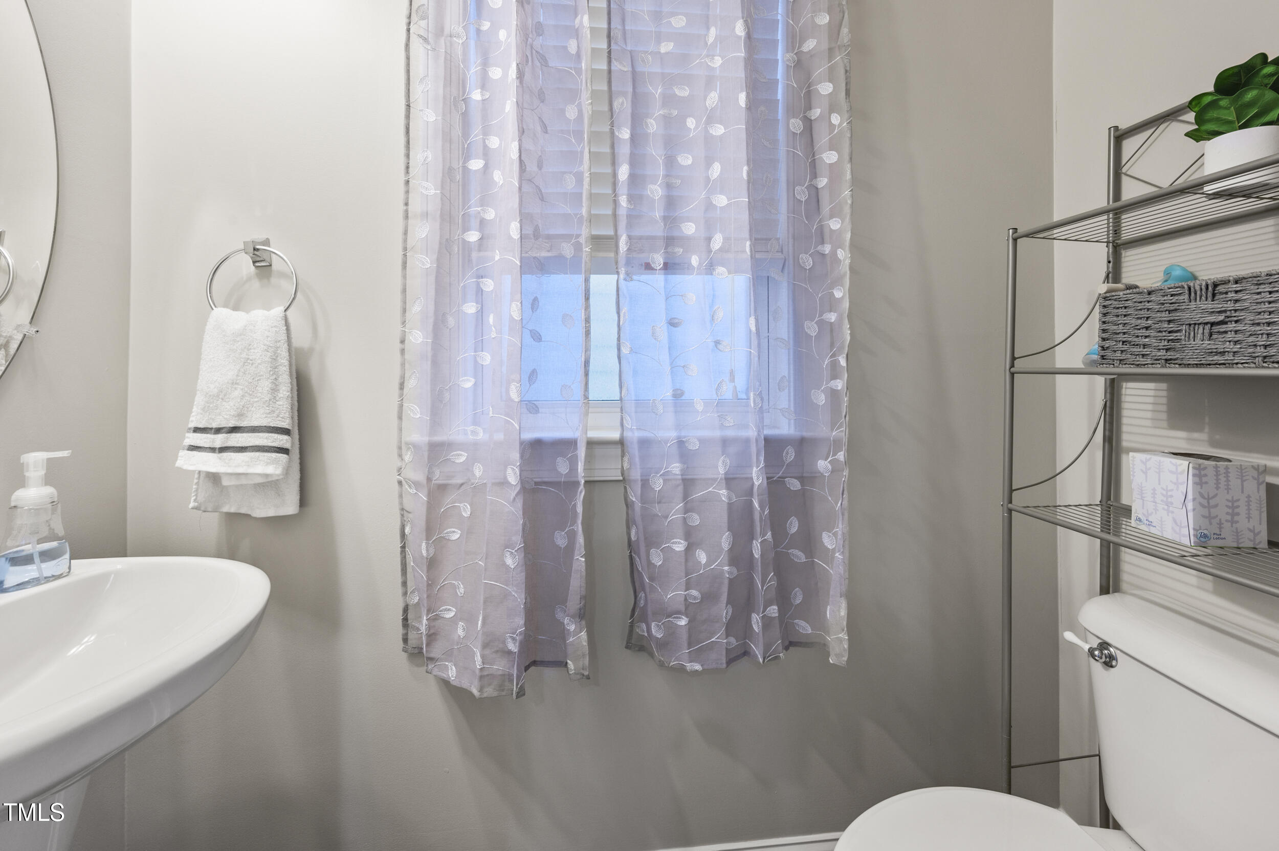 1204 Chapanoke Road Raleigh, NC 27603 - Photo 21 of 45 a bathroom with a shower curtain