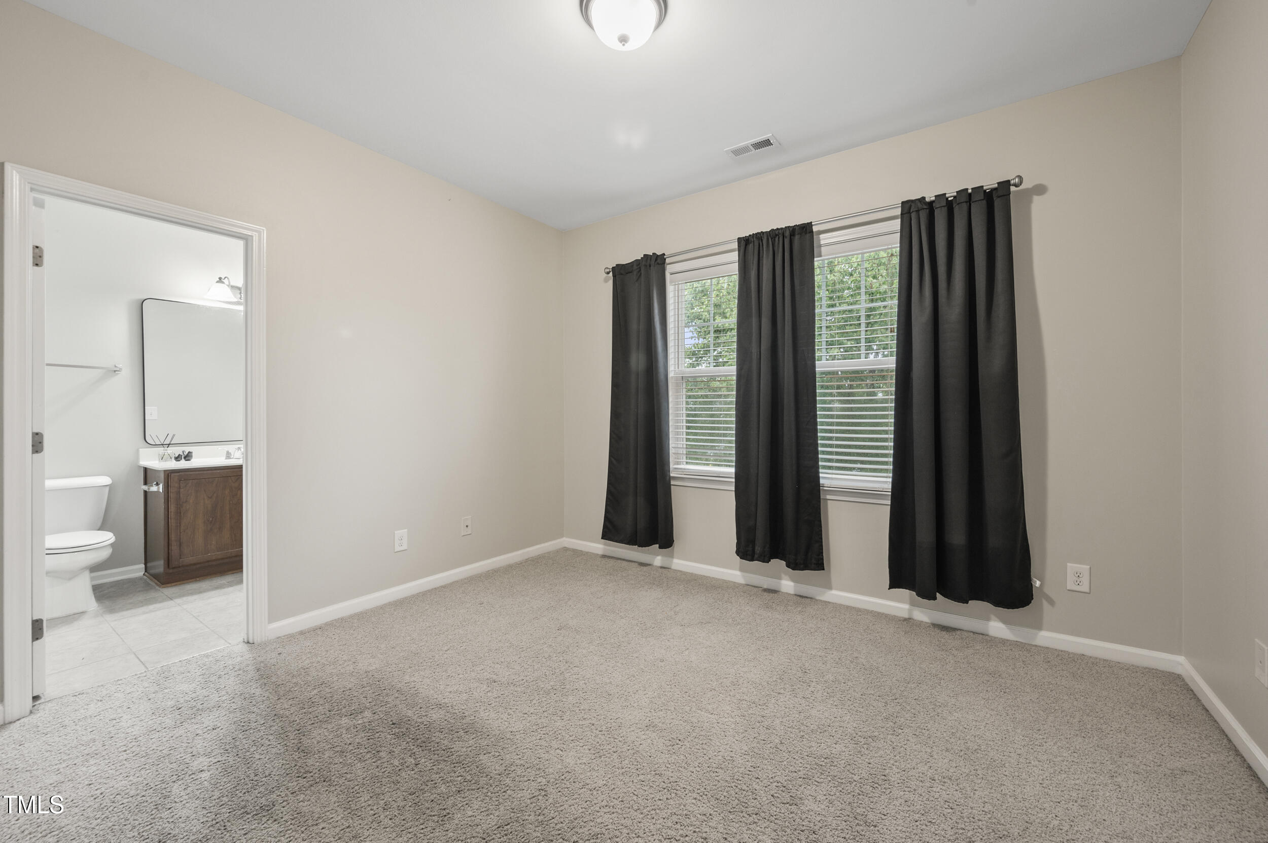 1204 Chapanoke Road Raleigh, NC 27603 - Photo 23 of 45 a view of an empty room with a window
