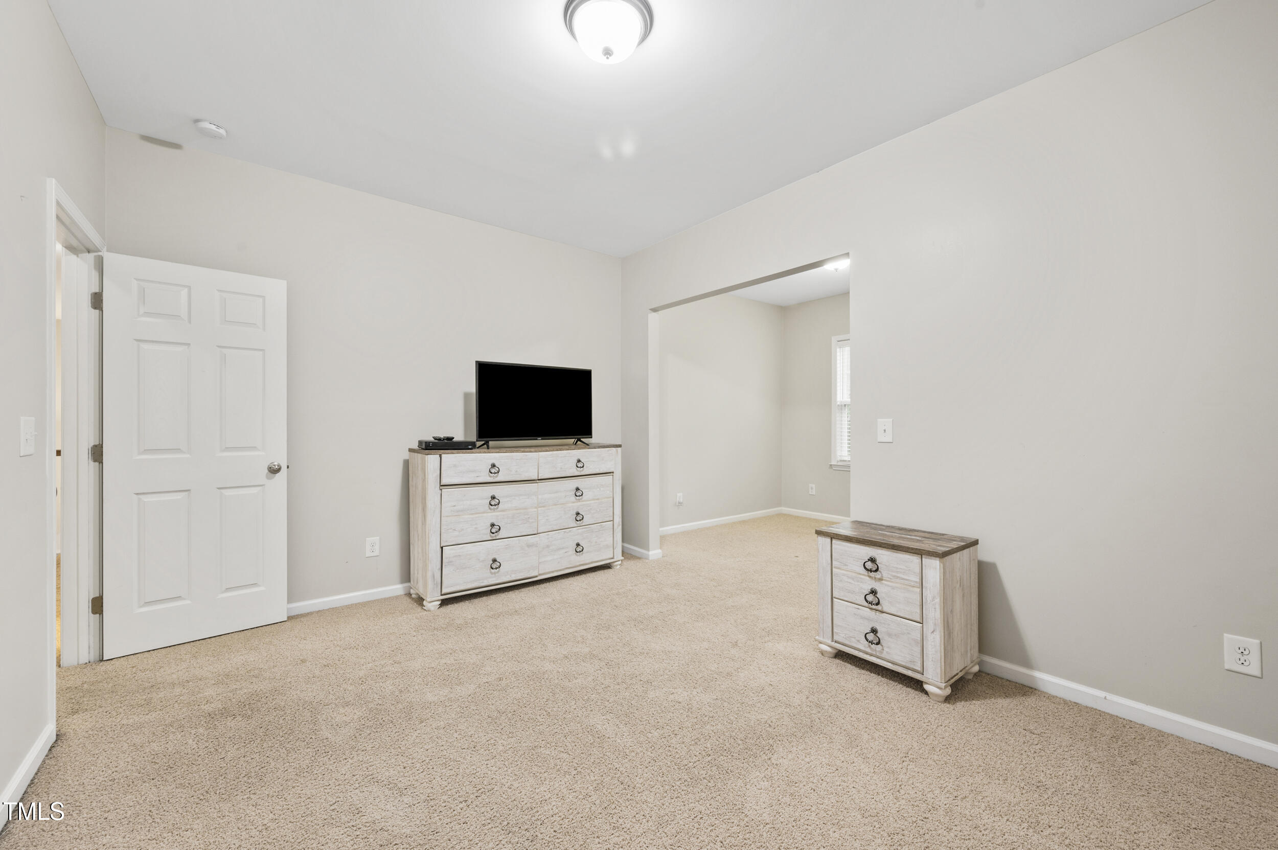 1204 Chapanoke Road Raleigh, NC 27603 - Photo 28 of 45 a room with furniture and flat screen tv
