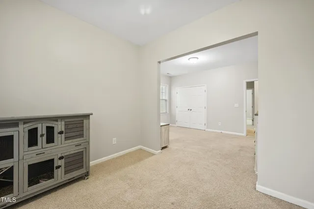 an empty room with fireplace