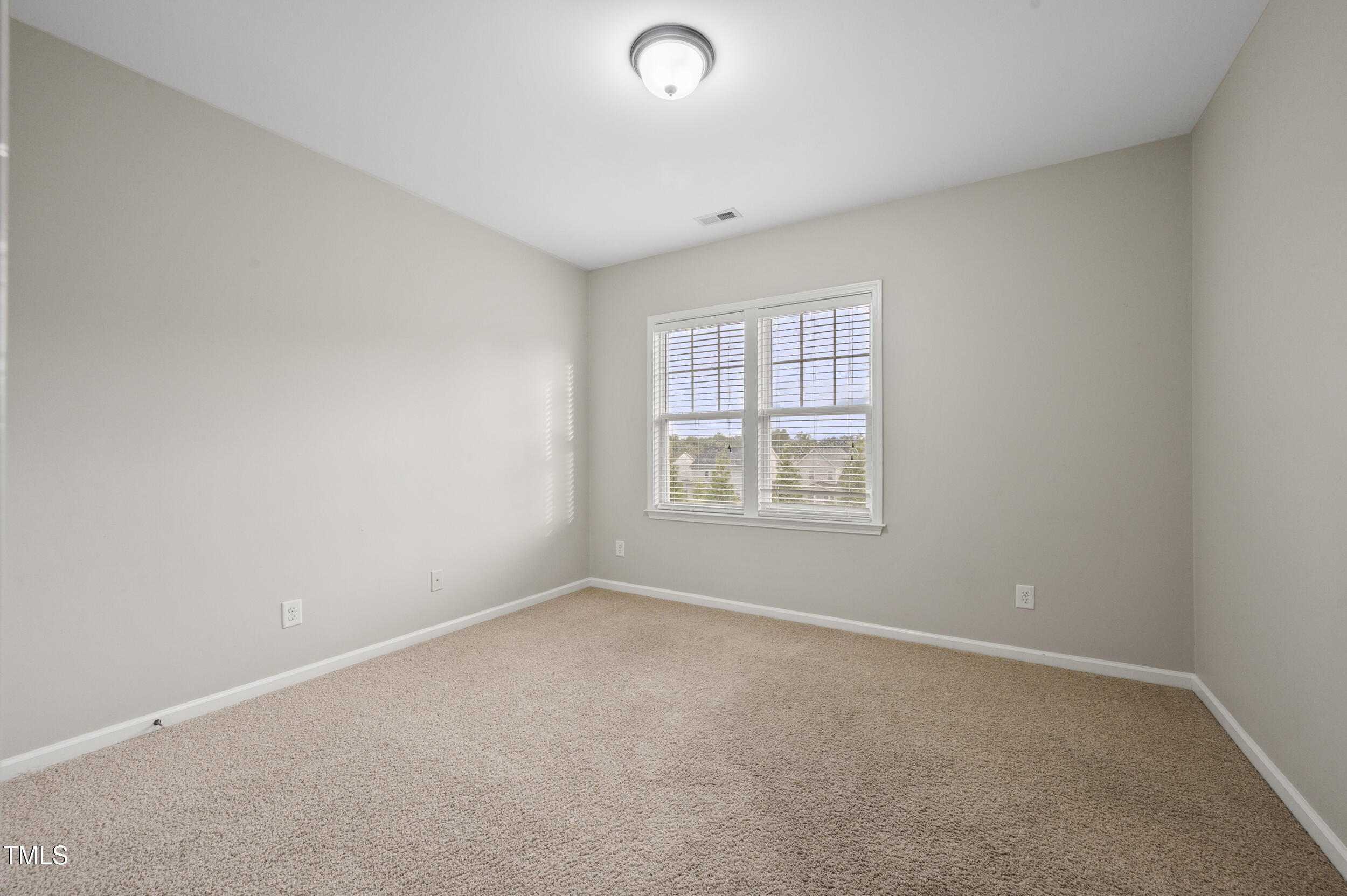 1204 Chapanoke Road Raleigh, NC 27603 - Photo 32 of 45 an empty room with windows
