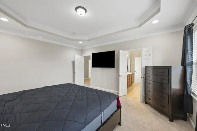 a bathroom with a double vanity sink a large mirror and a shower