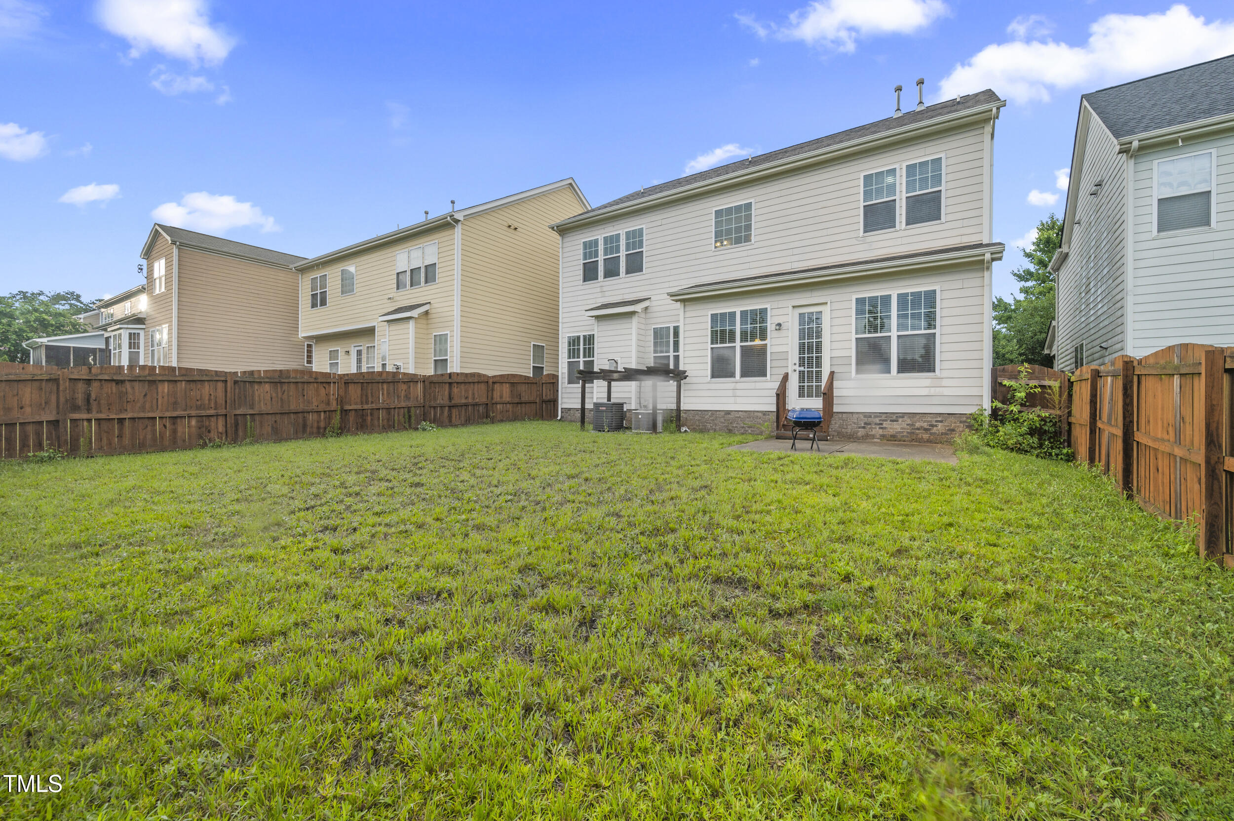 1204 Chapanoke Road Raleigh, NC 27603 - Photo 41 of 45 a view of a house with a yard and sitting area