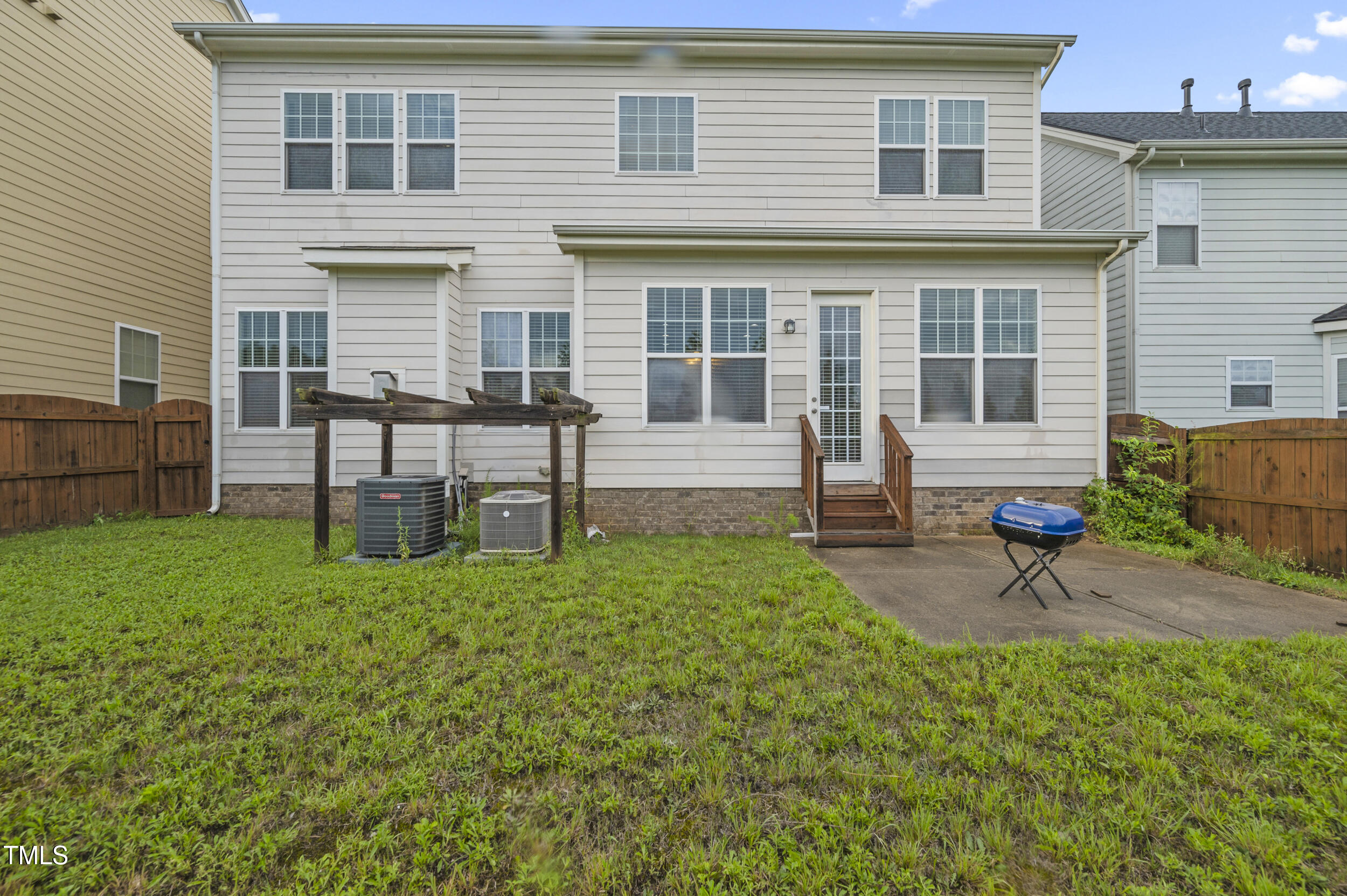 1204 Chapanoke Road Raleigh, NC 27603 - Photo 42 of 45 a house view with a sitting space and garden