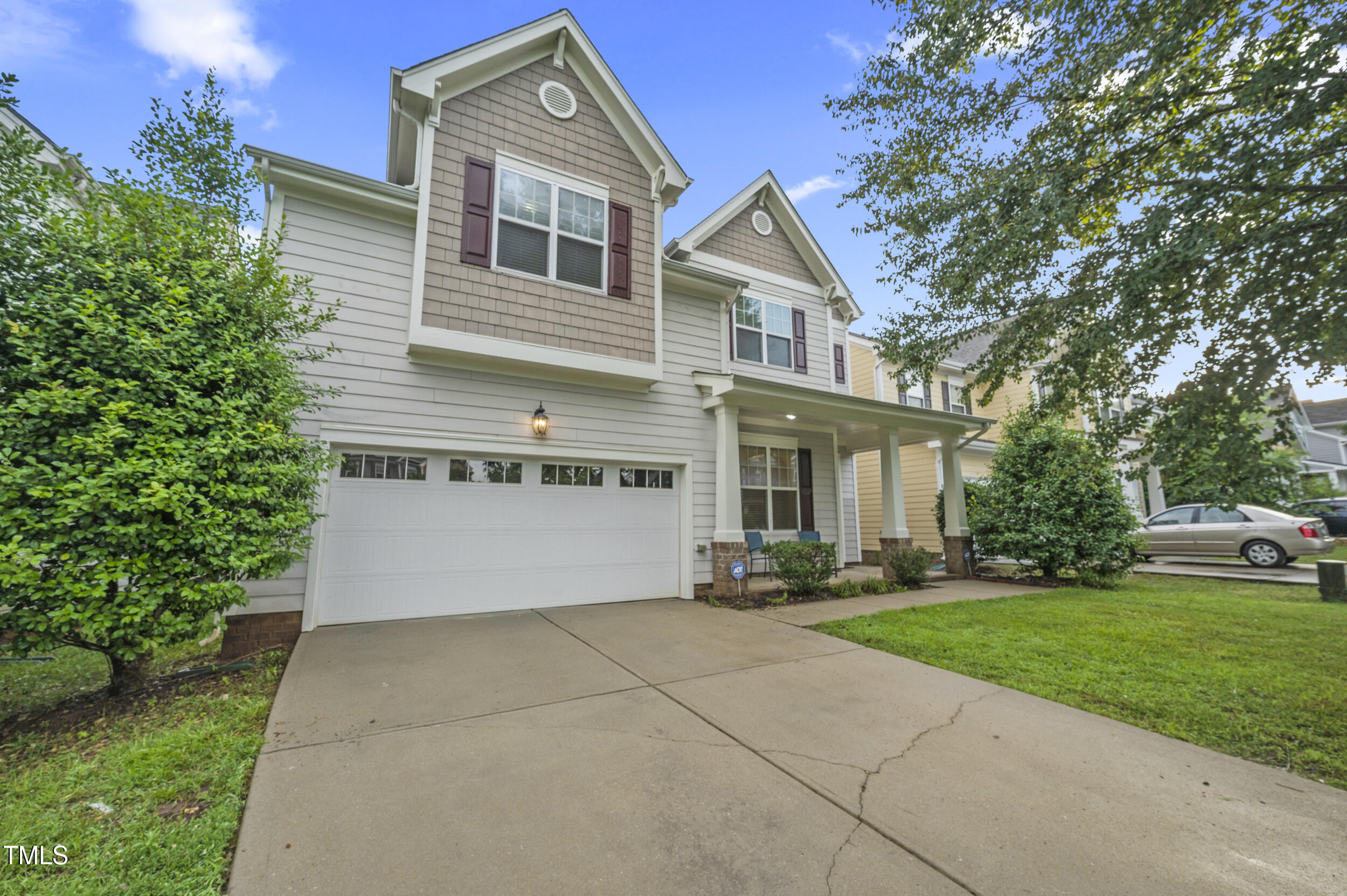 1204 Chapanoke Road Raleigh, NC 27603 - Photo 4 of 45 a front view of a house with a yard and trees