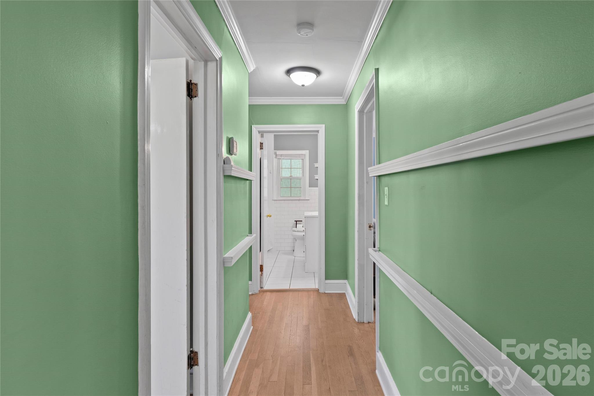 951 Dodson Mill Road Pilot Mountain, NC 27041 - Photo 19 of 48 a view of hallway with stairs and wooden floor