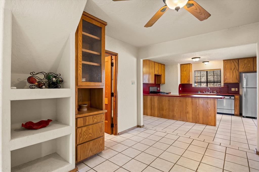 1601 Stafford Road Weatherford, TX 76088 - Photo 12 of 40 a kitchen with stainless steel appliances granite countertop a refrigerator and a stove top oven
