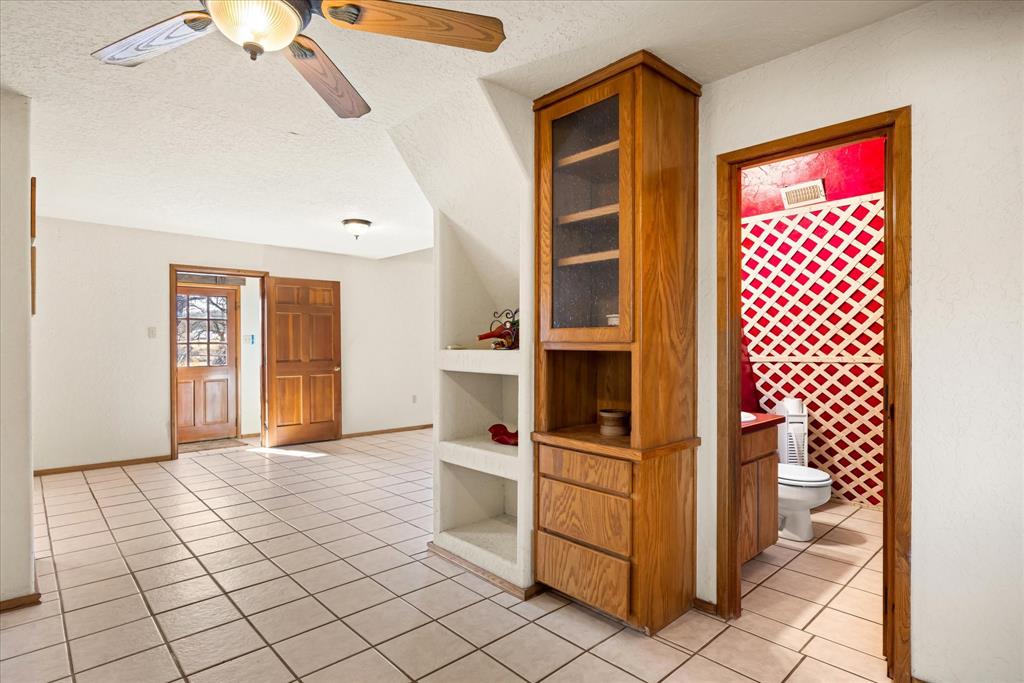 1601 Stafford Road Weatherford, TX 76088 - Photo 13 of 40 a view of a hallway with wooden cabinets and entryway