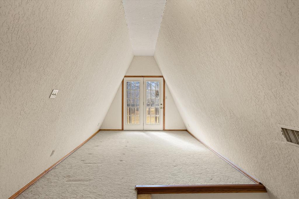 1601 Stafford Road Weatherford, TX 76088 - Photo 28 of 40 a view of a big room with wooden floor and windows