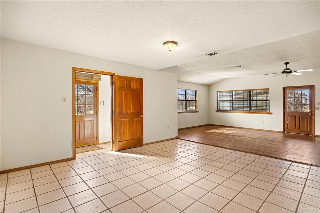 1601 Stafford Road Weatherford, TX 76088 - Photo 4 of 40 a view of an empty room with a window